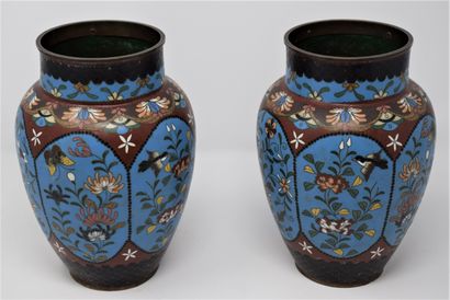 null 
A pair of cloisonné vases on a copper base, decorated with flowers, butterflies...