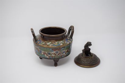 null A bronze and cloisonné enamelled tripod incense burner, the grip in the shape...