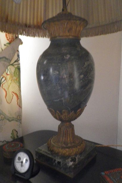 null 
A green marble and bronze baluster lamp in the Empire style decorated with...