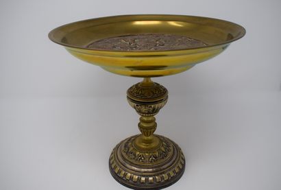 null In the taste of Barbedienne, 

Cup on foot in bronze and brass with central...