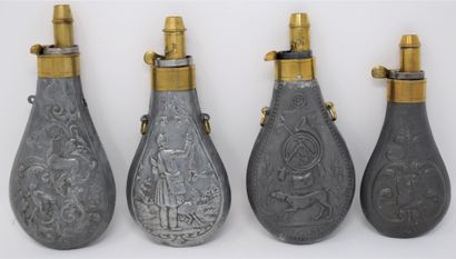 Four brass and zinc embossed powder flasks...