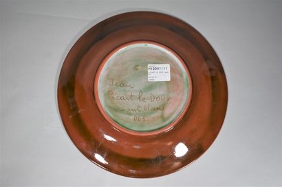 null PICART LE DOUX Jean (1902-1982)

Glazed ceramic plate with a stylized flower...