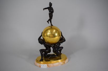 null Spherical brass urn held by two bronze Atlases, the goddess Fortune (lacking...