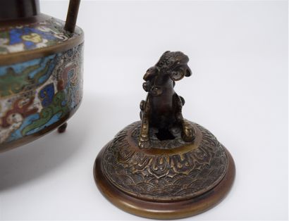 null A bronze and cloisonné enamelled tripod incense burner, the grip in the shape...