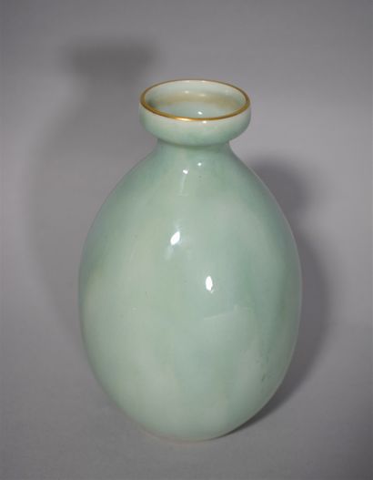null SEVRES 

Vase piriform with widened neck in shaded celadon porcelain, the neck...