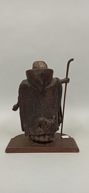 null Wooden statue representing a pilgrim holding in his right hand his staff.

19th...