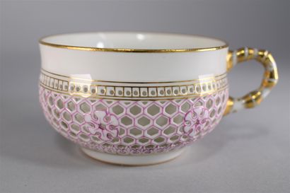 null SEVRES 

Cup whose handle simulates the bamboo and its saucer in reticulated...