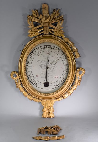 Barometer in carved and gilded wood, oval...