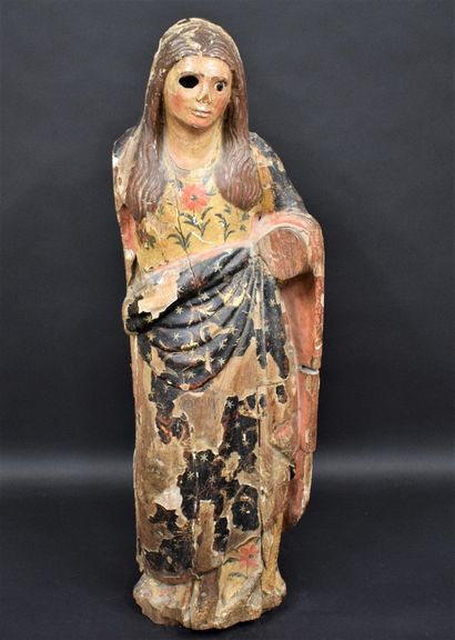 null 
Polychrome wood sculpture representing a woman draped in a garment with floral...