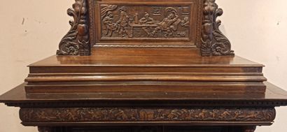 null 
Dresser in natural wood carved in the lower part with a decoration of foliage,...