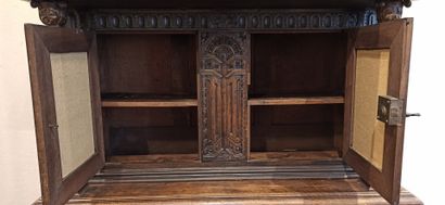 null 
Dresser in natural wood carved in the lower part with a decoration of foliage,...