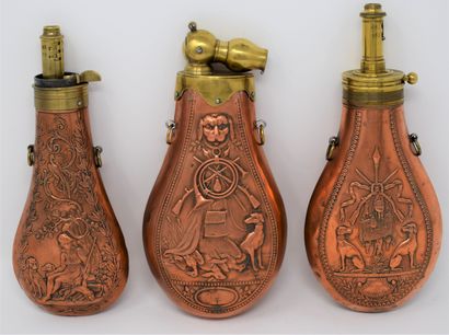 Three brass and copper powder flasks with...