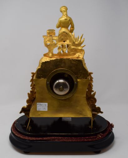 null Romantic ormolu clock decorated with a standing gentleman, a jewel box on a...