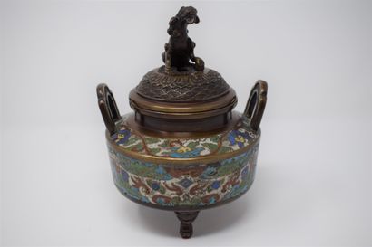 null A bronze and cloisonné enamelled tripod incense burner, the grip in the shape...