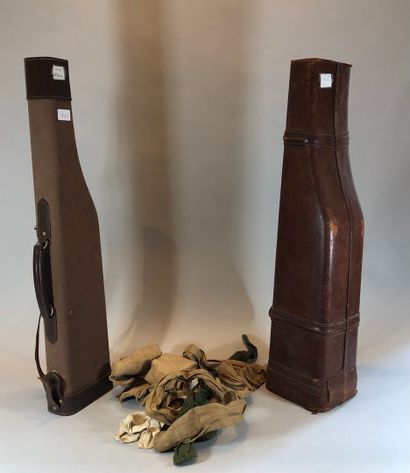 null Two gun cases: one in leather and the other in fabric
