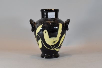 null VALLAURIS

Black ceramic vase decorated with yellow doves, signed and numbered...