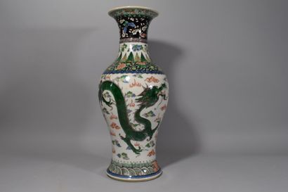 null CHINA

Porcelain vase with polychrome enamel decoration of blue and green dragons.

Height:...