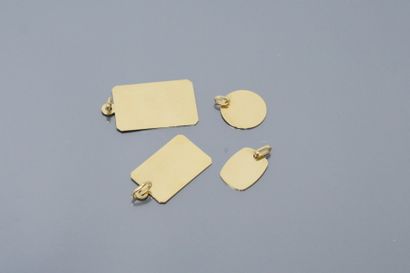  Lot of four 18k (750) yellow gold plates mounted as oval, rectangular and round...