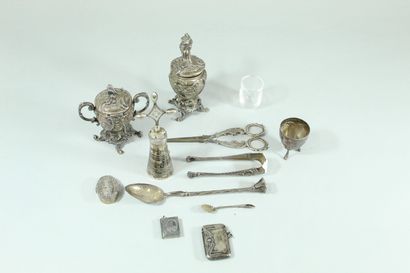 null Lot of silverware including : 

- 1 pepper pot with rocaille pattern

- 1 mustard...
