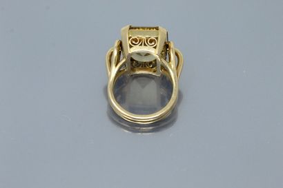 null An 18k (750) yellow gold openwork ring set with a rectangular cut citrine. 

Hallmark...