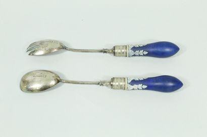 null Pair of silver plated salad servers. 

Bakelite handles decorated with white...