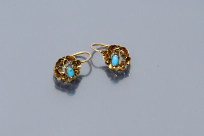  Pair of 18k (750) yellow gold dormeuses decorated with a flower, the center set...
