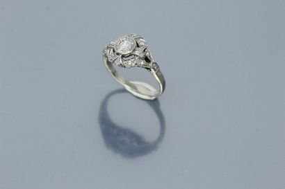  18k (750) white gold and platinum ring set with an old-cut diamond in a circle of...