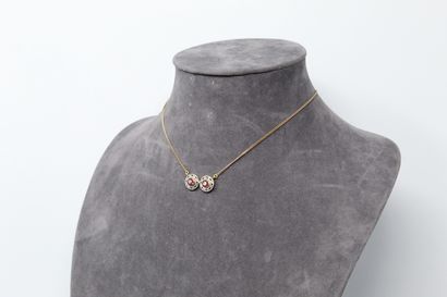 null 18K (750) yellow gold necklace, the pendant formed by two discs adorned with...