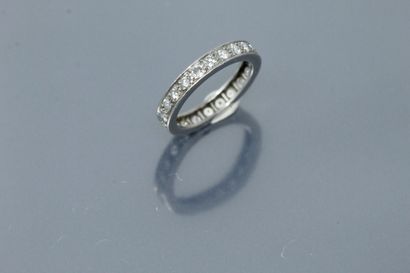 null American wedding band in platinum (dog's head hallmark) set with diamonds. 

Finger...