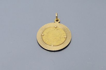 null 18K (750) yellow gold pendant holding a 20 franc Napoleon II barehead gold coin,...