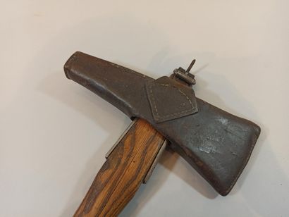 null Swiss regulation axe with its leather.