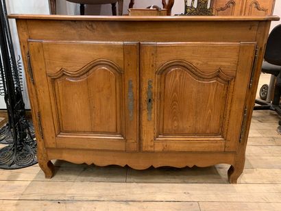 null Walnut sideboard opening with two doors and resting on gabled feet 

Provencal...