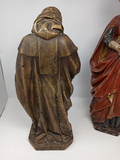 null Set of two sculptures of characters, one representing a monk and the other a...