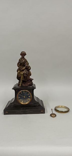 null A terminal clock surmounted by a bronze sculpture of a young girl with a garland...