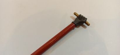 null Cane, pommel decorated with a closed hand holding a stick,

length: 84 cm