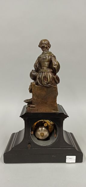 null A terminal clock surmounted by a bronze sculpture of a young girl with a garland...