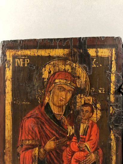  ICÔNE DOUBLE, tempera sur bois et charnière métal, représentant à gauche la Vierge...