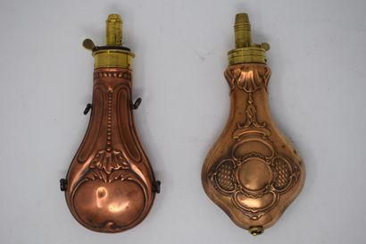null Two repoussé copper powder flasks and brass dispenser:

- piriform, with pearl...