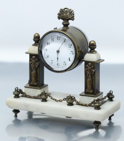 null Portico clock

Hard stone and metal base, enamelled dial with white background,...