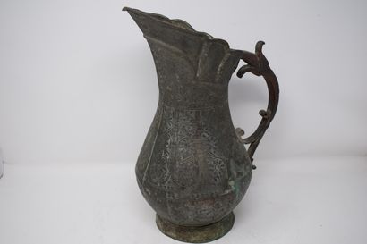 null 
Pitcher in tinned copper with rich chased decoration of flowers. Late 18th...