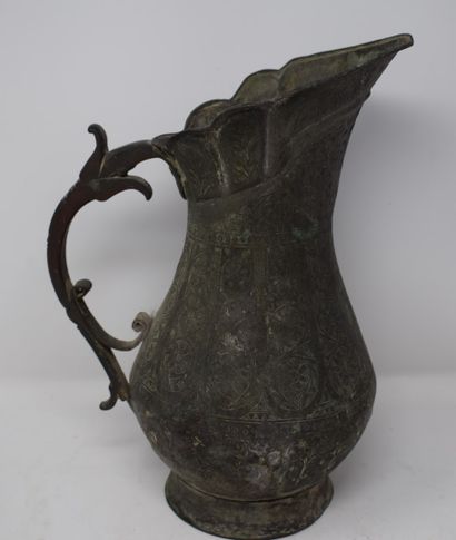 null 
Pitcher in tinned copper with rich chased decoration of flowers. Late 18th...