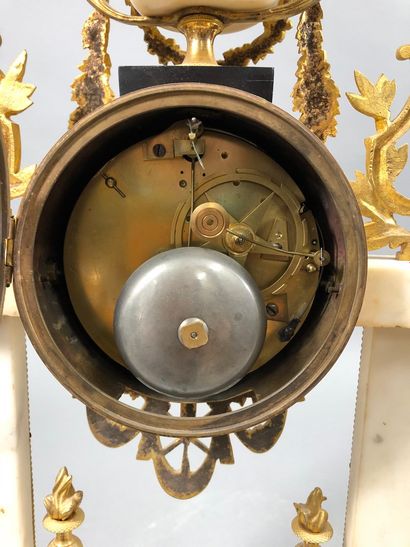 null White marble and gilt bronze clock of portico form, the dial with Arabic numerals,...