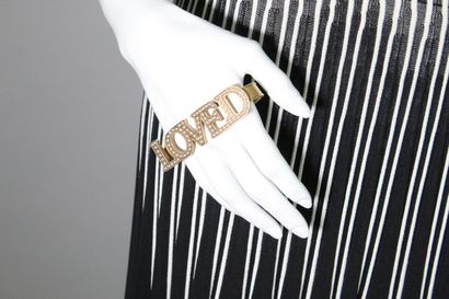 GUCCI



Hand ring in gilded brass with the...