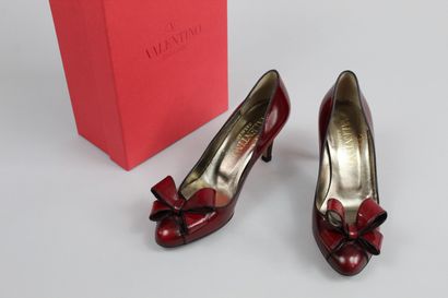 VALENTINO



Pair of deep red glacé leather...