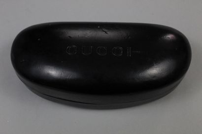 null GUCCI 

Pair of sunglasses, tinted glasses in its case signed Gucci. 

A cloth...
