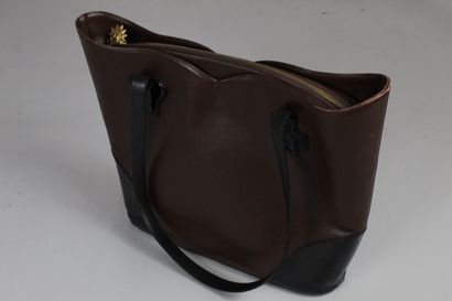 null CHRISTIAN LACROIX 

Brown leather and black glazed leather bag. 

Heart and...