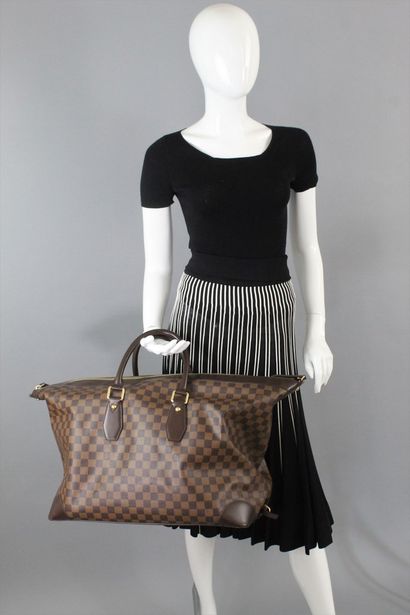 null 
LOUIS VUITTON



All Day" model travel bag, in checkerboard canvas and chocolate...