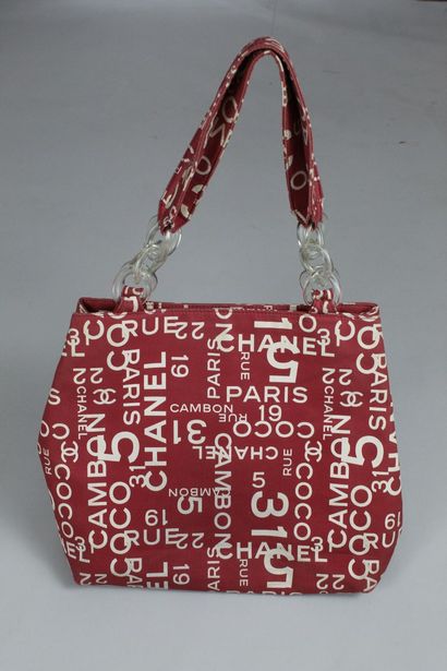 null CHANEL 

Red canvas tote bag with white house prints. 

Two handles, transparent...