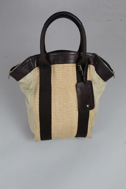 null YVES SAINT LAURENT

Handbag in brown leather, wicker and beige canvas. 

Declination...