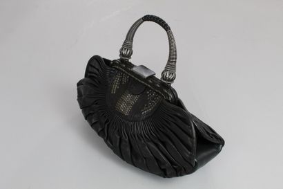 null CHRISTIAN DIOR 



Plissé" model handbag in black pleated lambskin, handle in...
